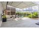 Covered patio including outdoor dining area and grill, great for entertaining at 3744 E Lake Dr, Land O Lakes, FL 34639