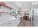 Modern kitchen with white shaker cabinets, quartz countertops, and stainless steel appliances at 3214 E Dr Martin Luther King Jr Blvd, Tampa, FL 33610