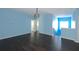 Bright bonus room with hardwood floors and light blue walls at 4212 Wildstar Cir, Wesley Chapel, FL 33544