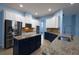 Spacious kitchen featuring stainless steel appliances and granite countertops at 4212 Wildstar Cir, Wesley Chapel, FL 33544