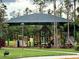 Covered playground with slides and playsets at 4212 Wildstar Cir, Wesley Chapel, FL 33544