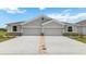 Front view of a two-unit house with double garages at 18330 Cropside Trl, Lakewood Ranch, FL 34211