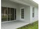 Covered patio with sliding glass doors at 31147 Whinsenton Dr, Wesley Chapel, FL 33543