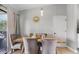 Dining area with a rustic wooden table and gray chairs at 455 Lenoir Nw St, Port Charlotte, FL 33948