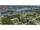 Aerial view showcasing the home's location near a canal and other houses at 455 Lenoir Nw St, Port Charlotte, FL 33948