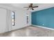 Bedroom with teal accent wall and light wood flooring at 455 Lenoir Nw St, Port Charlotte, FL 33948