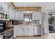 Modern kitchen featuring stainless steel appliances and wood-look backsplash at 455 Lenoir Nw St, Port Charlotte, FL 33948