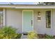 Light teal front door and gray exterior at 455 Lenoir Nw St, Port Charlotte, FL 33948