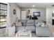 Living room featuring a gray sectional sofa and a large window at 455 Lenoir Nw St, Port Charlotte, FL 33948