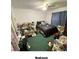 A bedroom with a double bed and carpeting, some clutter present at 4605 N 39Th St # 1/2, Tampa, FL 33610