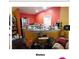 A cluttered kitchen with an island and stainless steel appliances at 4605 N 39Th St # 1/2, Tampa, FL 33610
