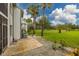 Private patio with tiled flooring and green space at 103 W Cypress Ct # 75, Oldsmar, FL 34677