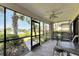 Screened-in porch with patio furniture and waterfront view at 636 Yardarm Dr # 636, Apollo Beach, FL 33572