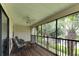 Relaxing screened porch with wooden deck and comfortable seating at 636 Yardarm Dr # 636, Apollo Beach, FL 33572