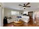 Bright living room with hardwood floors, sectional sofa, and coffee table at 636 Yardarm Dr # 636, Apollo Beach, FL 33572