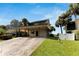 Front view of house with carport and landscaping at 636 Yardarm Dr # 636, Apollo Beach, FL 33572