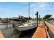 White sailboat at a private dock, next to another boat at 636 Yardarm Dr # 636, Apollo Beach, FL 33572
