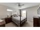 Cozy bedroom with a post bed, ceiling fan, and ample closet space at 636 Yardarm Dr # 636, Apollo Beach, FL 33572
