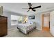 Bedroom with a ceiling fan and access to a hallway at 636 Yardarm Dr # 636, Apollo Beach, FL 33572