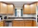 Kitchen features granite countertops and wood cabinets at 636 Yardarm Dr # 636, Apollo Beach, FL 33572