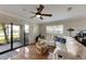 Living room with hardwood floors, sectional sofa, and sliding doors to patio at 636 Yardarm Dr # 636, Apollo Beach, FL 33572