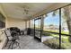 View of the waterfront from a screened-in porch with a patio set at 636 Yardarm Dr # 636, Apollo Beach, FL 33572