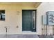 Dark green front door with a sidelight window at 636 Yardarm Dr # 636, Apollo Beach, FL 33572