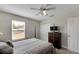 Comfortable bedroom with a post bed, ceiling fan, and dresser at 636 Yardarm Dr # 636, Apollo Beach, FL 33572