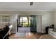 Living room with sliding glass doors leading to a patio overlooking the water at 636 Yardarm Dr # 636, Apollo Beach, FL 33572