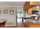 Open kitchen with granite countertops and wood cabinets at 636 Yardarm Dr # 636, Apollo Beach, FL 33572