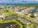 Aerial view highlighting the property's setting near water and roads at 636 Yardarm Dr # 636, Apollo Beach, FL 33572