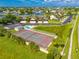 Community tennis court and pool area with surrounding green space at 636 Yardarm Dr # 636, Apollo Beach, FL 33572