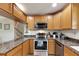 Modern kitchen with stainless steel appliances and granite countertops at 636 Yardarm Dr # 636, Apollo Beach, FL 33572