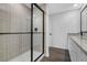 Modern bathroom with granite countertop, frameless shower, and tile at 29508 Fedora Cir, Brooksville, FL 34602