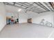 Spacious garage with epoxy flooring and ample storage at 17231 Holly Well Ave, Wimauma, FL 33598