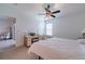 Bright and airy main bedroom with an attached bathroom at 17231 Holly Well Ave, Wimauma, FL 33598
