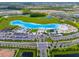 Aerial view of Crystal Lagoon community with resort-style amenities at 17231 Holly Well Ave, Wimauma, FL 33598