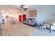 Spacious living room featuring a large area rug and comfortable seating at 17231 Holly Well Ave, Wimauma, FL 33598