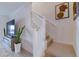Modern staircase with white railing and neutral carpet at 17231 Holly Well Ave, Wimauma, FL 33598