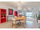 Bright dining room features a round table and chairs, and access to the living room at 17231 Holly Well Ave, Wimauma, FL 33598