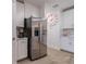 Stainless steel refrigerator in a modern kitchen setting at 17231 Holly Well Ave, Wimauma, FL 33598