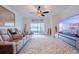 Bright living room with fireplace, large TV, and comfortable seating at 17231 Holly Well Ave, Wimauma, FL 33598