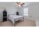 Comfortable bedroom with a bed, shelving and large window at 17231 Holly Well Ave, Wimauma, FL 33598