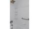Clean bathroom with a bathtub and shower, grab bar and tile surround at 8699 Bardmoor Blvd # 304, Seminole, FL 33777