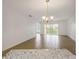 Bright living room with tile floors and sliding glass doors at 8699 Bardmoor Blvd # 304, Seminole, FL 33777