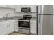 Modern kitchen with stainless steel appliances and granite counters at 8699 Bardmoor Blvd # 304, Seminole, FL 33777