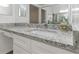 Bathroom with granite countertop, single sink, and white cabinets at 8699 Bardmoor Blvd # 304, Seminole, FL 33777