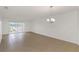 Bright and airy living room with tile floors and balcony access at 8699 Bardmoor Blvd # 304, Seminole, FL 33777