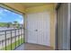 Balcony with double doors and view of the community at 8699 Bardmoor Blvd # 304, Seminole, FL 33777