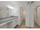 Bright bathroom with granite countertop and double sinks at 8699 Bardmoor Blvd # 304, Seminole, FL 33777